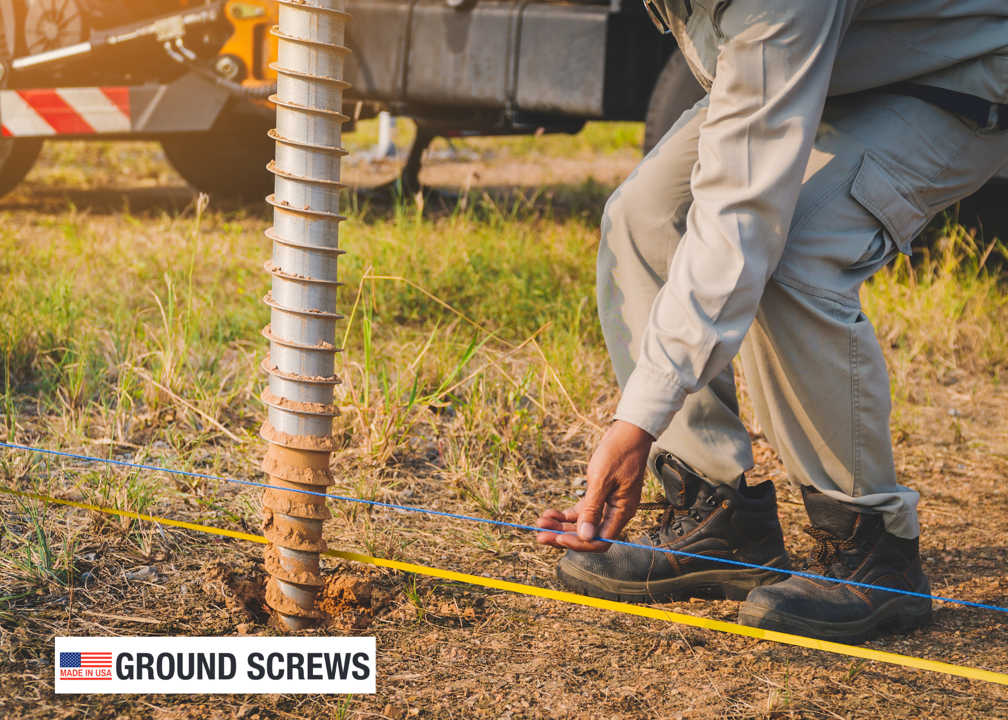 Close-up of ground screw installation process